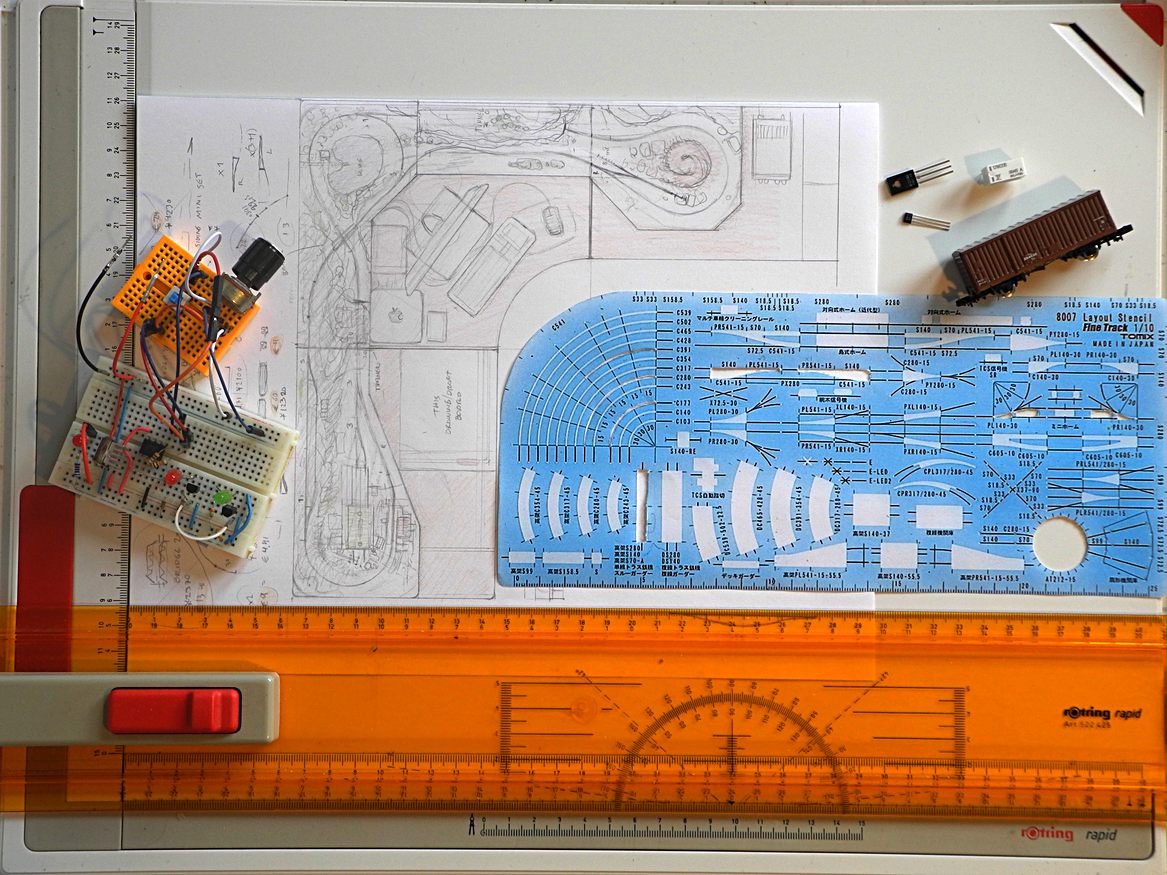 Not a picture of dwarves playing tennis, but a draft board with an N-gauge layout.